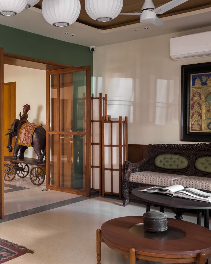 In the transitioning space sits an antique elephant sourced from an ancient temple; Photography by Prachi Khasgiwala