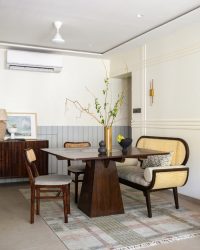 Dining chairs and a carved console from Fabindia bring in artisanal charm, while a rug from Jaipur Rugs adds warmth and grounding underfoot; Photography by Manish Malli