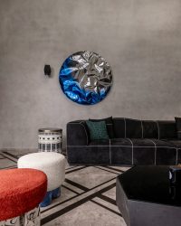 The den’s eclectic spirit comes alive through Nitush Aroosh’s Tronco poufs, Rame wall sculpture and Mushroom Lamp. Marble flooring by Stone Capital and furniture from DrawFour are paired with a side table from The House of Things; Photography by Kuber Shah