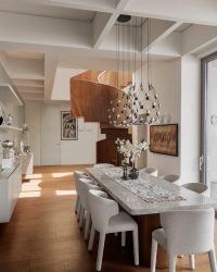 The home houses decorative light fixtures from Louis Poulsen, Foscarini, Luceplan, Davide Groppi, Ingo Maurer, Gubi, Vibia, Artemide, And Tradition and Bolia; Photography by Bajirao Pawar