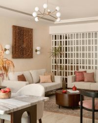Pops of colour are brought in subtly through artwork, textiles, and accessories, lending a feel of layered but calm; The furniture is from Timbaar, rug from Carpet Kingdom, planter from Make My Garden and lighting from The White Teak Company, Philips; Styling by Shivani Raina, Photography by Nayan Soni